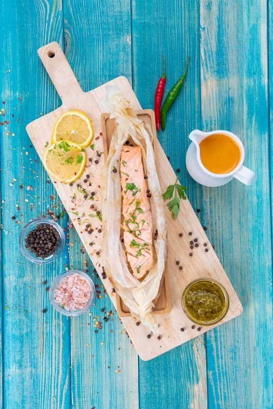 Baked Salmon in Grilled Paper with Lemon Slices and Spices (Salt and Pepper)