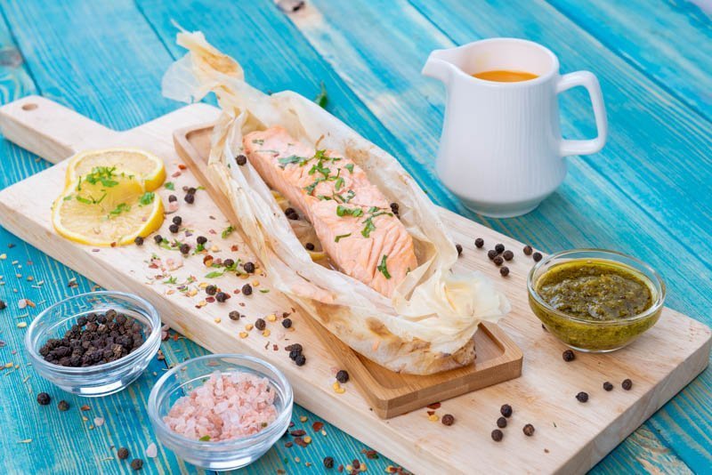 Baked Salmon in Grilled Paper with Lemon Slices and Spices (Salt and Pepper)