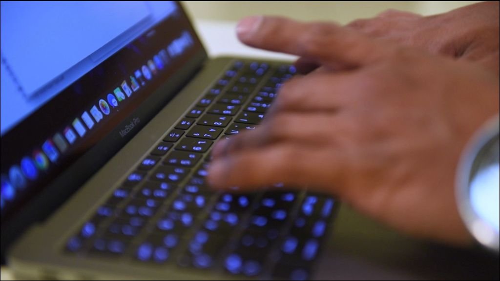 Arabic man working on laptop and mobile